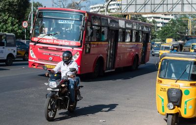 Traffic with public transport red bus in Chennai, India