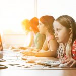 Girl with Down syndrome using computer