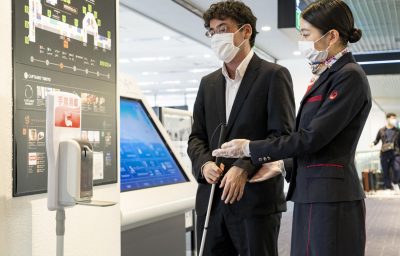 Jax Staff assisting a blind passenger
