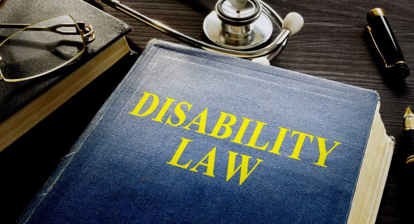 Disability Law book and stethoscope on the desk.
