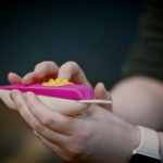 woman with vision disabilities checking pregnancy test