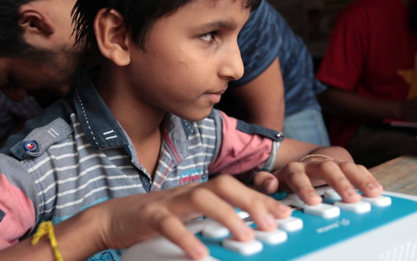 a blind boy learning braille
