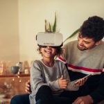 Cute young african american girl using a VR headset.