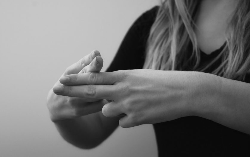 Woman interpreting in Sign Language