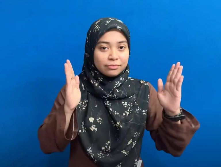 A female signing Malaysia Sign Language
