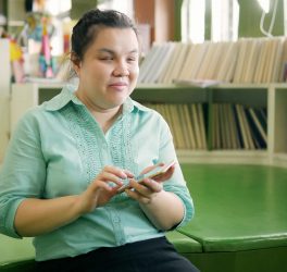 young blind woman using smartphone