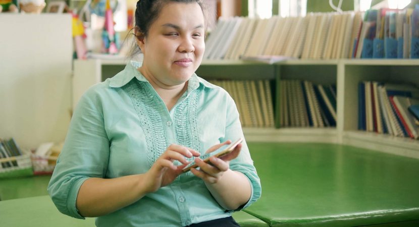 young blind woman using smartphone