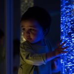kid exploring snoezelen space