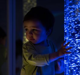 kid exploring snoezelen space