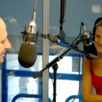 white male and female radio presenters in local radio station