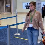 Passenger wearing Hidden Disabilities Sunflower Lanyard