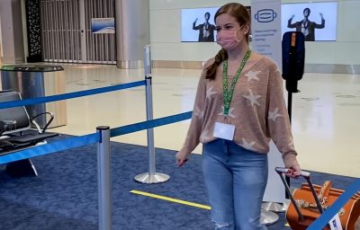 Passenger wearing Hidden Disabilities Sunflower Lanyard