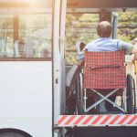 Disabled man in Wheelchair Boarding Bus