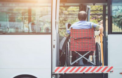 Disabled man in Wheelchair Boarding Bus
