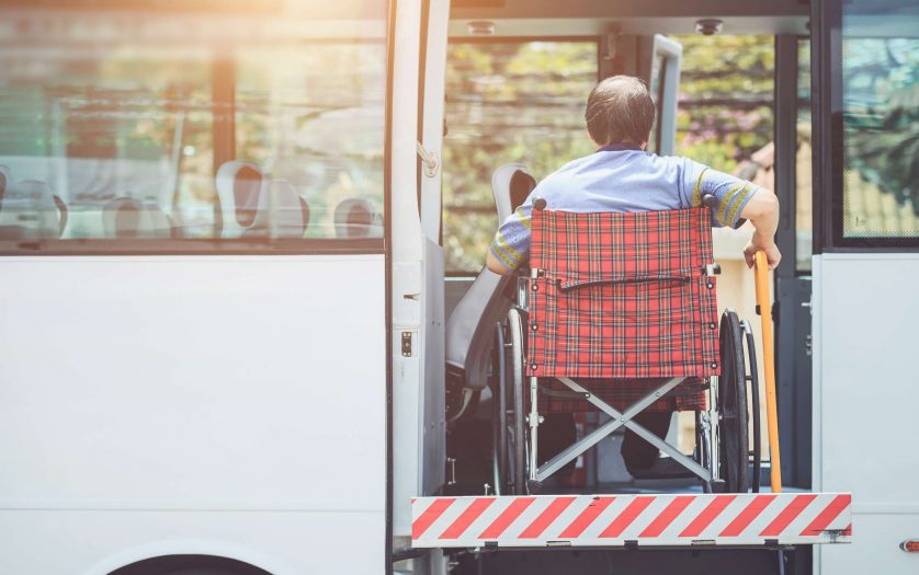 Disabled man in Wheelchair Boarding Bus