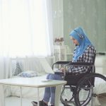 woman in wheelchair attending the meeting