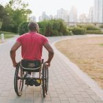 African man in a wheelchair in the park