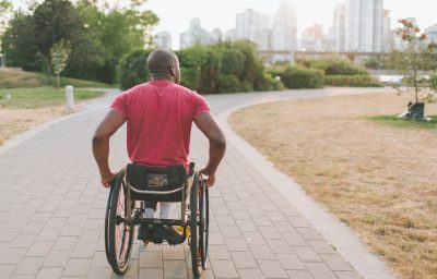 African man in a wheelchair in the park