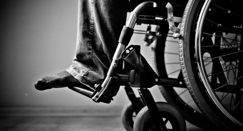 man in wheelchair at home, close up