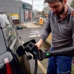 A driver with disability charging the EV vehicle
