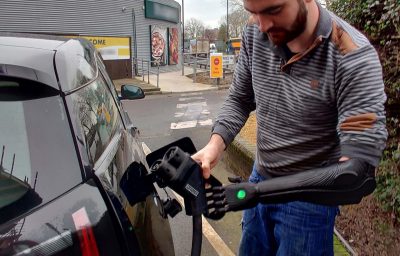 A driver with disability charging the EV vehicle