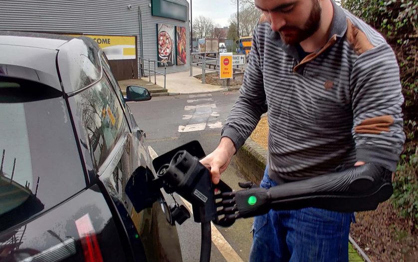A driver with disability charging the EV vehicle