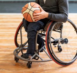 Close-up disabled man holding basketball