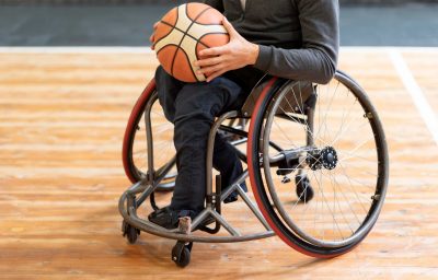 Close-up disabled man holding basketball