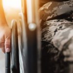 Woman veteran in wheelchair, Close-up
