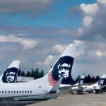 Alaska Airlines jets at the Seattle Airport waiting to be loaded with passengers and luggage.