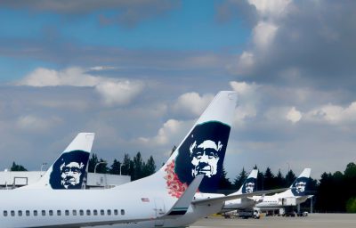 Alaska Airlines jets at the Seattle Airport waiting to be loaded with passengers and luggage.