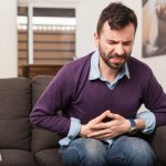 Young man with a stomach pain
