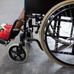 Boy sitting on wheelchair