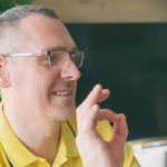 Deaf man talking using sign language on the smart phone