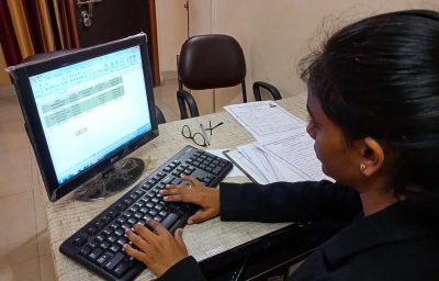 indian female office incharge working on personal computer in India