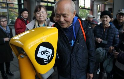 Tapping an ORCA card at a Link Light Rail station in pre-pandemic days.
