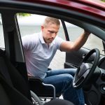 man in wheelchair boarding the car