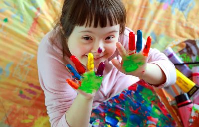 Cute little girl with painted hands