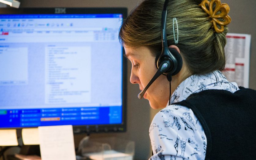 Portrait of telephone operator with headset.