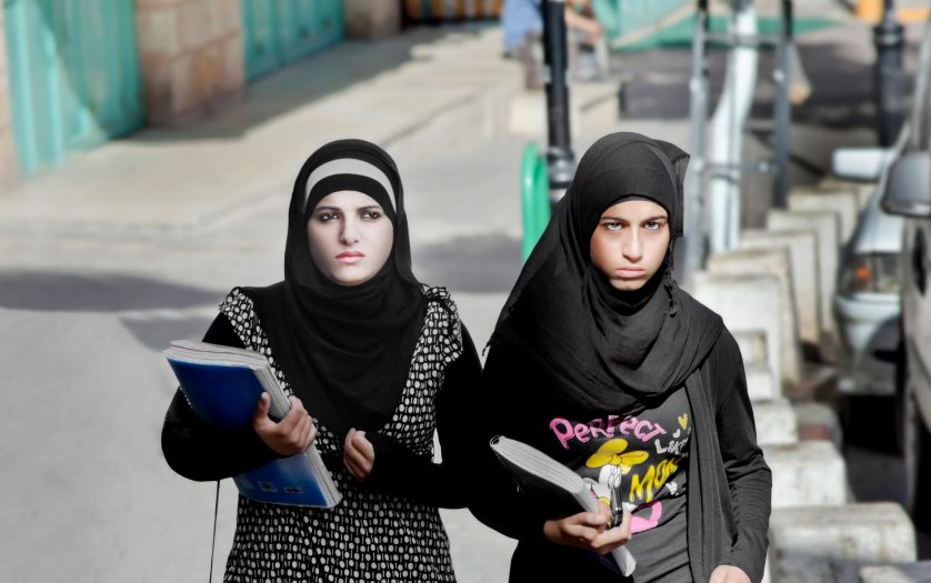 Female students walking down the street in Bethlehem, Palestine.