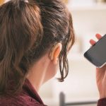 Deaf woman using smartphone