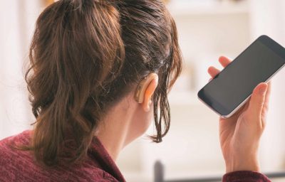 Deaf woman using smartphone