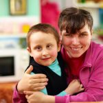 Cheerful children with disabilities in rehabilitation center