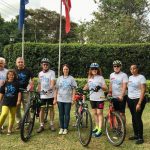 Ambassador Jacek Bazański and his family with cyclists