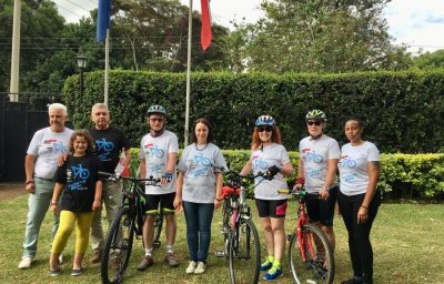 Ambassador Jacek Bazański and his family with cyclists
