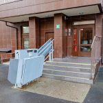 Lift for wheelchair users at the entrance of an apartment building