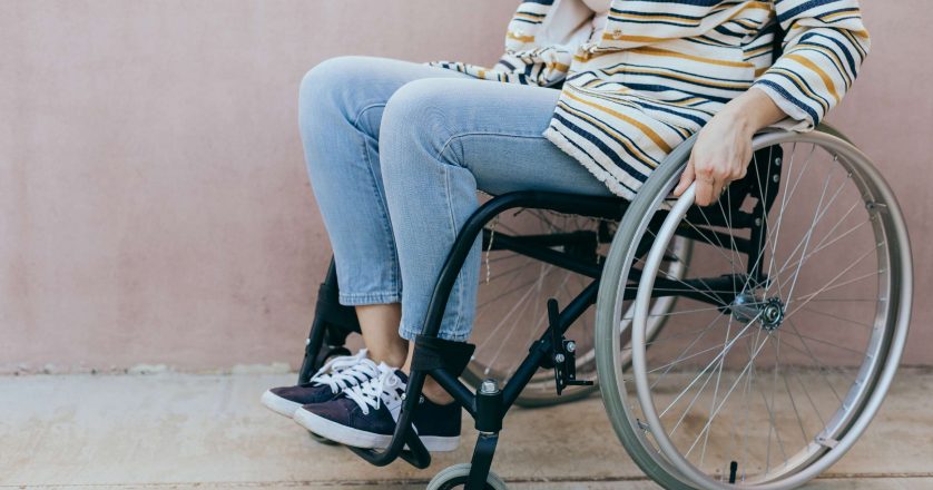 woman young woman in a wheelchair outdoors