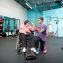trainer with woman in wheelchair