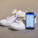 Ashirase vibration device attached to shoes and Ashirase smartphone app screen