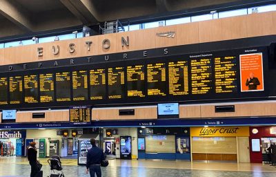 British Sign Language Screens viewed from the concourse at London Euston